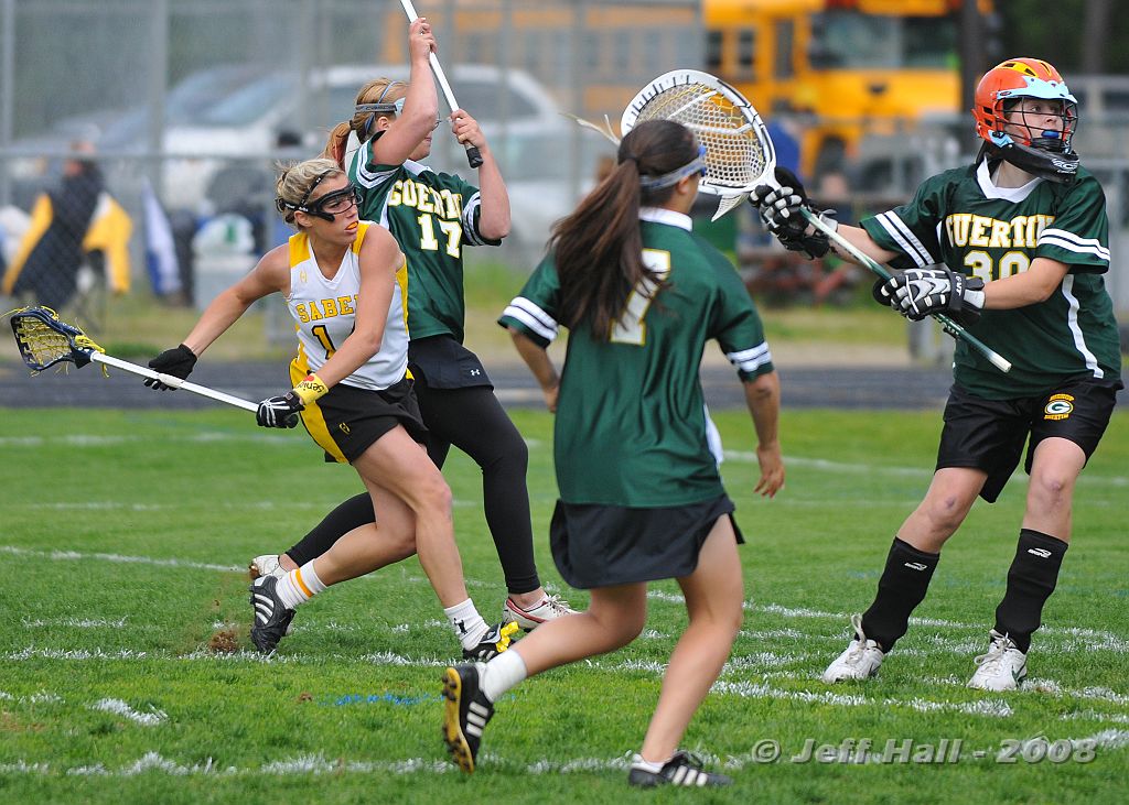 JLH_0881.JPG - Senior Danielle Pelletier shoots goal in heavy traffic for Souhegan Sabers