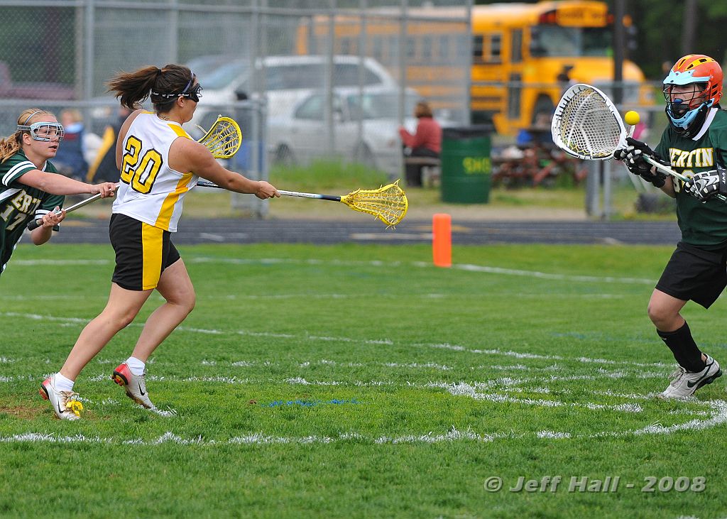 JLH_0888.JPG - Senior JoJo Curro goes one-on-one with BG goalie CC Carlini to score for the Souhegan Sabers