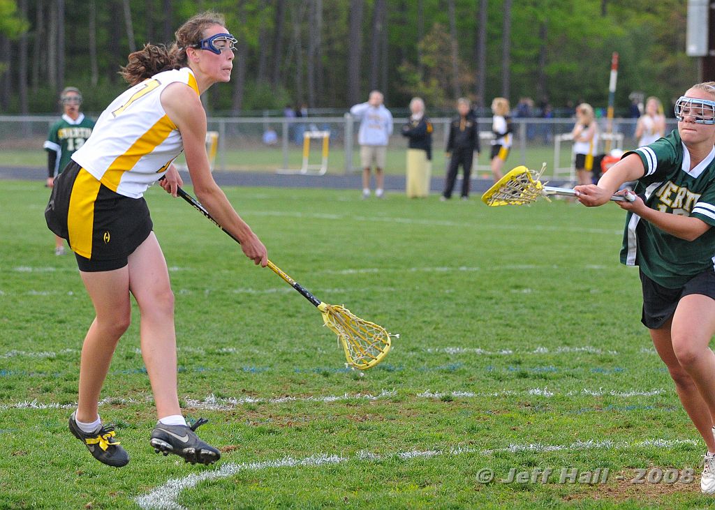 JLH_0994.JPG - Senior Tyler Petropulos launches one in the goal for the Souhegan Sabers
