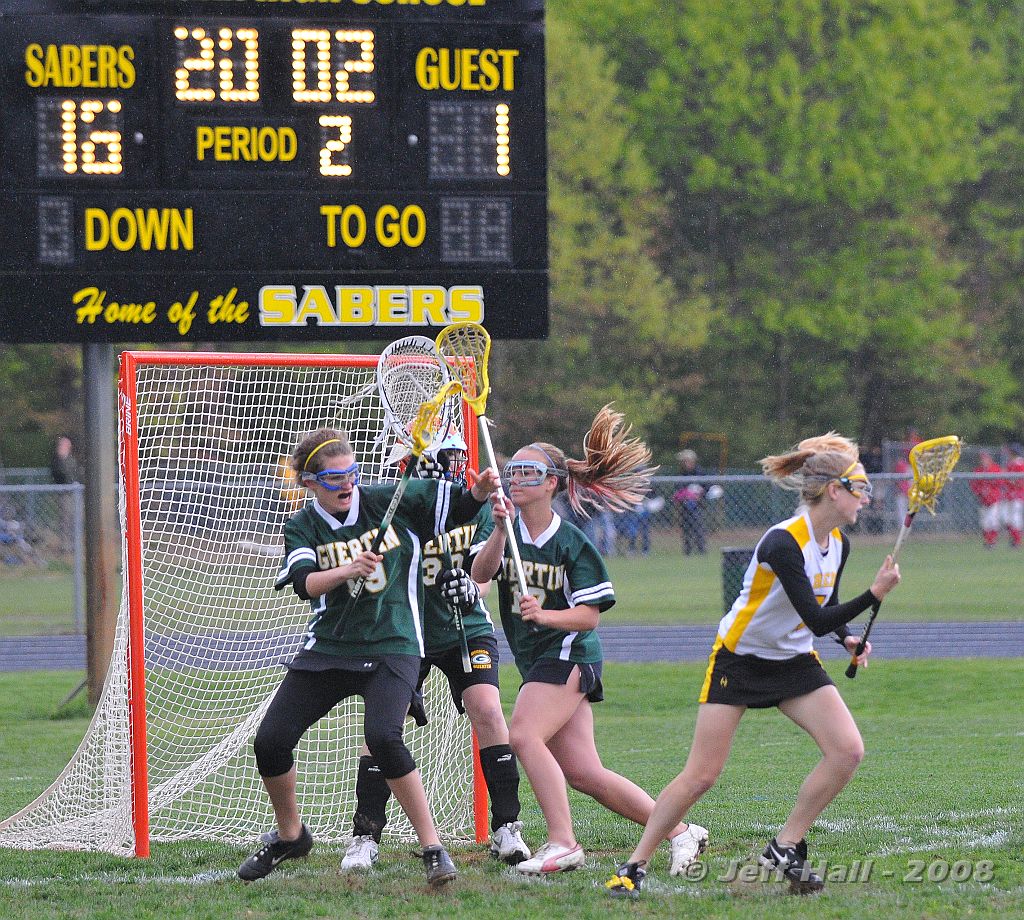 JLH_1191.JPG - Senior Teydin Hall of the Sabers manuevering for a shot by the BG goal